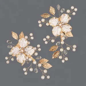 Handmade floral bridal hair clip with faux pearls and gold alloy leaves for weddings
