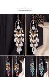 Detailed view of Bohemian teardrop tassel earrings with intricate white and blue beaded accents