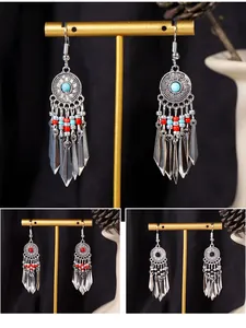 Vintage Bohemian style tassel drop earrings with turquoise, red, and black bead accents.