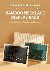 Close-up detail of bamboo wood necklace display racks featuring various premium finishes