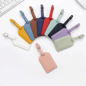 Detail view showing multiple colors of skin-feel PU leather luggage tags in a fan layout.