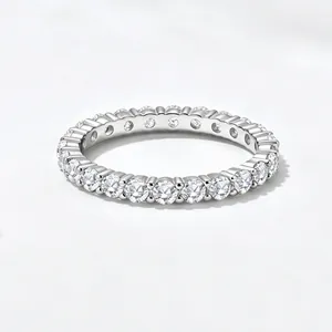 Macro detail of a 925 sterling silver eternity ring with sparkling ice flower cut zircons