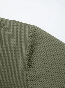 Close-up of olive green ice-feel textured fabric and shoulder seam on men's Polo shirt