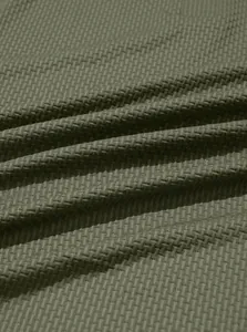 Close-up detail of olive green waffle knit texture on men's cooling elastic polo shirt