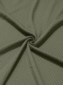Close-up of olive green waffle texture fabric for men's stretch Polo shirt