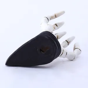 Detailed back view of a 3D white skeleton hand wall hook showing the mounting hole for easy setup