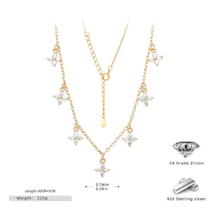 Detailed view of golden S925 sterling silver necklace featuring elegant zircon cross-flower charms
