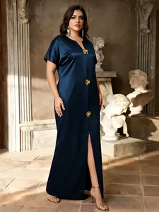 Elegant navy blue satin maxi dress featuring gold floral buttons and a stylish front slit.