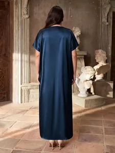 Detailed back view of a luxury navy blue satin maxi dress featuring short sleeves.