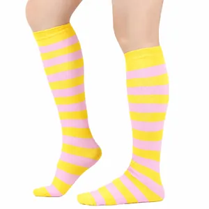 Detailed close-up view of vibrant pink and yellow striped knee-high performance socks for women