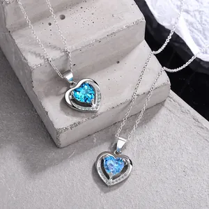 Macro view of Ocean Heart blue stone pendant on a premium silver-tone clavicle chain