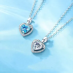 Close-up of Ocean Heart necklaces with blue and clear heart-shaped crystals