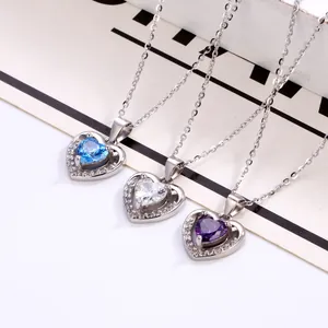Elegant heart-shaped necklaces with blue, clear, and purple stones on silver chains
