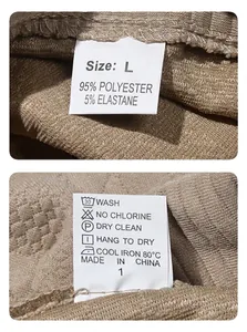 Close-up of fabric label showing size and washing instructions for knitted sweatshirt