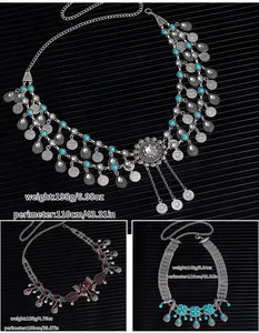 Detailed macro view of vintage coin waist chains with weight and size specifications