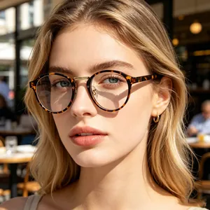 Fashionable vintage round tortoiseshell frame glasses for women in outdoor café setting