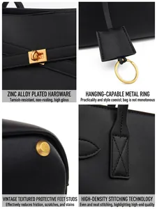 Black large capacity tote bag with gold-tone hardware and high-density stitching details
