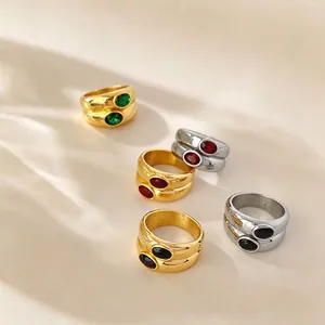 Macro detail shot of vintage titanium steel rings featuring colorful zircon gemstones