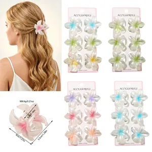 Detailed view of floral frangipani hair claw clips showing dimensions and color sets