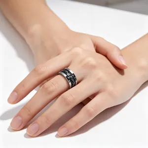 Vintage punk titanium steel ring featuring cross pattern worn on male model hand
