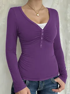 Close-up of purple Y2K long-sleeve T-shirt with buttoned V-neck and ruched bust detail