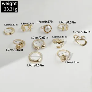 Detailed measurements of 10-piece gold irregular geometric and pearl ring set.