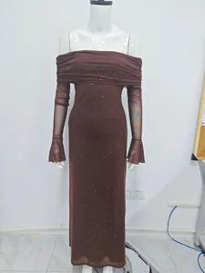 Close-up detail showing the brown off-shoulder dress with sparkling silver sequin accents.