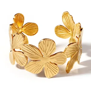 18K gold plated stainless steel open cuff bracelet featuring irregular floral patterns