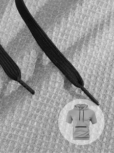 Detail view of men's grey heavy short sleeve hoodie showcasing fabric texture and black drawstring.