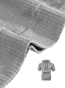 Macro detail of grey textured fabric on a casual men's short-sleeve hooded T-shirt