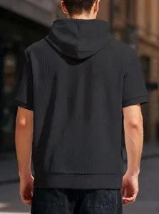 Back view of a black waffle-knit hooded t-shirt for men, stylish urban casual wear.