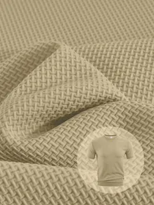 Macro detail of khaki seersucker fabric on a men's breathable short-sleeve T-shirt
