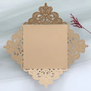 Detailed view of champagne laser cut hollow wedding invitation card with lace patterns