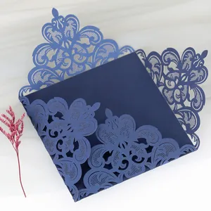 Exquisite laser-cut navy blue wedding invitation card with intricate floral lace pattern