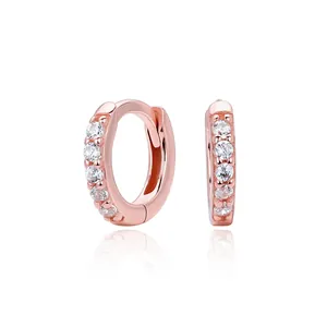 High-definition close-up showing the intricate zirconia inlay on rose gold hoop earrings