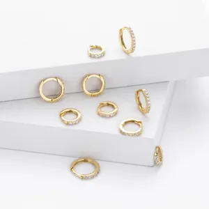 Detailed view of gold-plated S925 sterling silver hoop earrings with sparkly zircons.