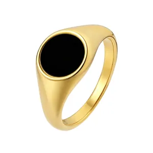 Minimalist gold signet ring with a round black enamel inlay for men and women