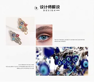 Detail showing two Hamsa hand charms with evil eye motifs and sparkling rhinestones for DIY jewelry.