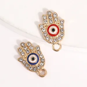 Gold Hamsa Hand charms with rhinestone borders and colorful enamel evil eye centers