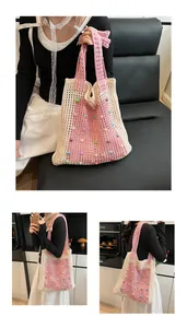 Casual pink and beige hollow-out knitted tote bag with colorful pearl accents on model