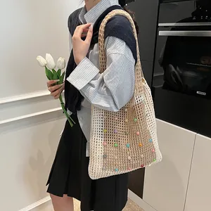 Modern beige crochet tote bag with colorful beads in a stylish lifestyle kitchen scene