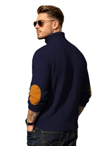 Premium men's navy cable knit turtleneck sweater featuring brown suede elbow patches