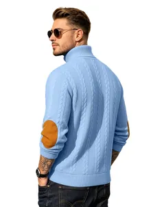Detailed view of the blue cable knit turtleneck sweater featuring brown elbow patches