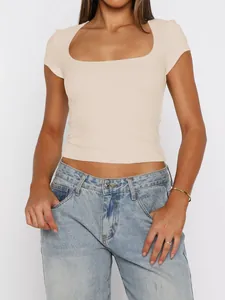 Detailed view of the square neckline and slim fit on this beige short sleeve T-shirt.