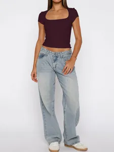 Burgundy square neck short sleeve t-shirt paired with light wash wide-leg jeans