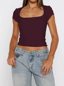 Detail of a dark burgundy square neck crop top featuring a slim fit and short sleeves.