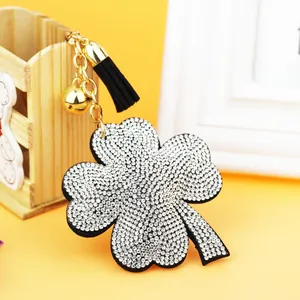 Sparkling rhinestone four-leaf clover keychain with black tassel and bell bag pendant