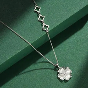 Elegant S925 sterling silver four-leaf clover necklace with white cat eye stone petals