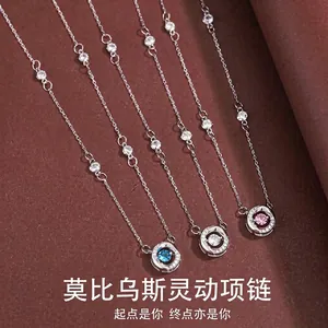 Detailed view of elegant silver Mobius necklaces with colored sparkling crystals