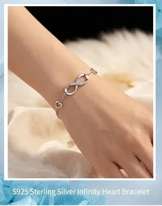 Elegant macro view of S925 sterling silver infinity heart bracelet on a female wrist